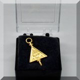 J12. Delta Mu Delta pin.